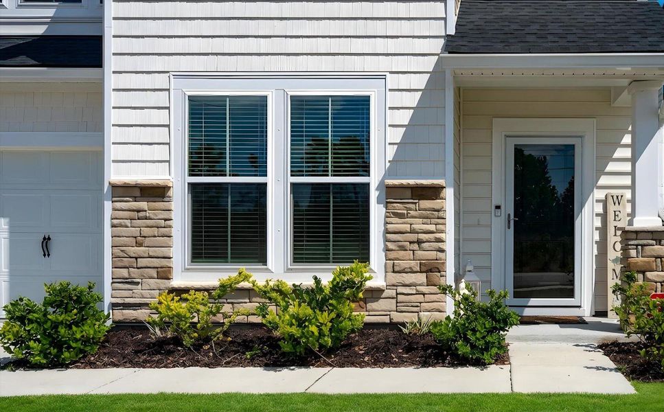 Exterior details and patio area of a home in , Johns Island (Image 30).