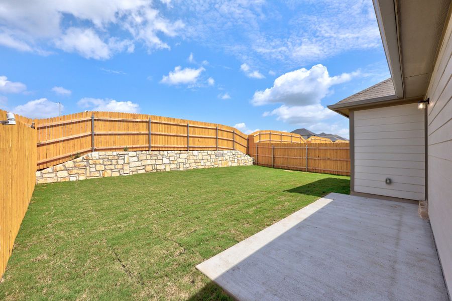 Exterior details and patio area of a home in Trinity Ranch, Elgin (Image 4).
