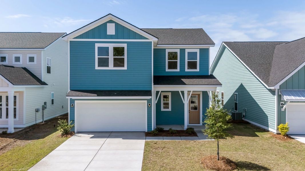 Front exterior of a new home in Blue Heron Retreat, Little River, SC, highlighting curb appeal (Image 1). Front exterior of a new home in Blue Heron Retreat, Little River, SC, highlighting curb appeal (Image 1).