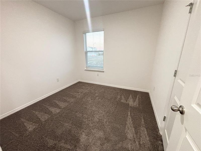 Spacious, unfurnished interior of a new home in Lake Deer Estates, Poinciana (Image 13).