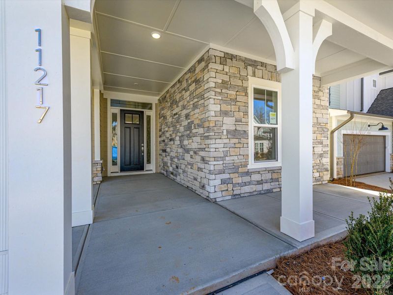 Exterior details and patio area of a home in North Creek Village, Huntersville (Image 4).