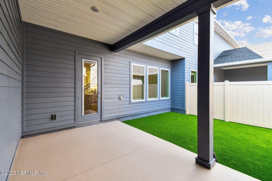 Front exterior of a new home in Seven Pines 24' Rear Entry Townhomes, Jacksonville, FL, highlighting curb appeal (Image 2).
