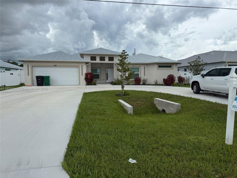 Front exterior of a new home in , Port St. Lucie, FL, highlighting curb appeal (Image 18). Front exterior of a new home in , Port St. Lucie, FL, highlighting curb appeal (Image 18).