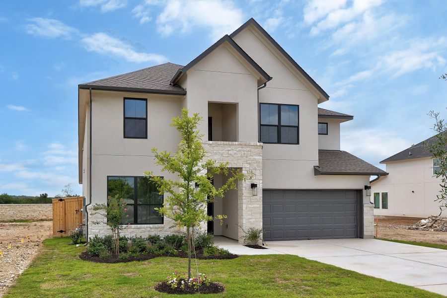 Front exterior of a new home in Nolina, Georgetown, TX, highlighting curb appeal (Image 21). Front exterior of a new home in Nolina, Georgetown, TX, highlighting curb appeal (Image 21).