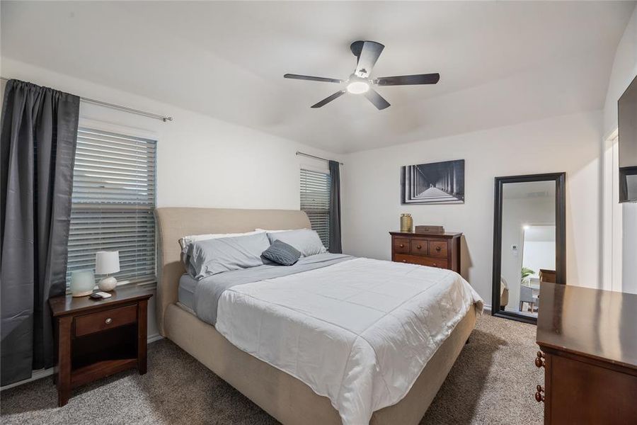 Bedroom featuring carpet flooring and a ceiling fan