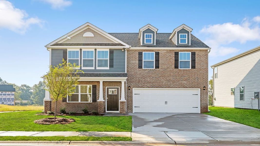 Front exterior of a new home in Hunters Ridge, Woodruff, SC, highlighting curb appeal (Image 1). Front exterior of a new home in Hunters Ridge, Woodruff, SC, highlighting curb appeal (Image 1).