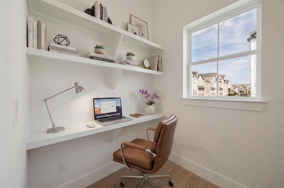 On the second floor, which is your primary suite floor, there is an office nook, just at the top of the stair landing. With a nice size window for lots of light.