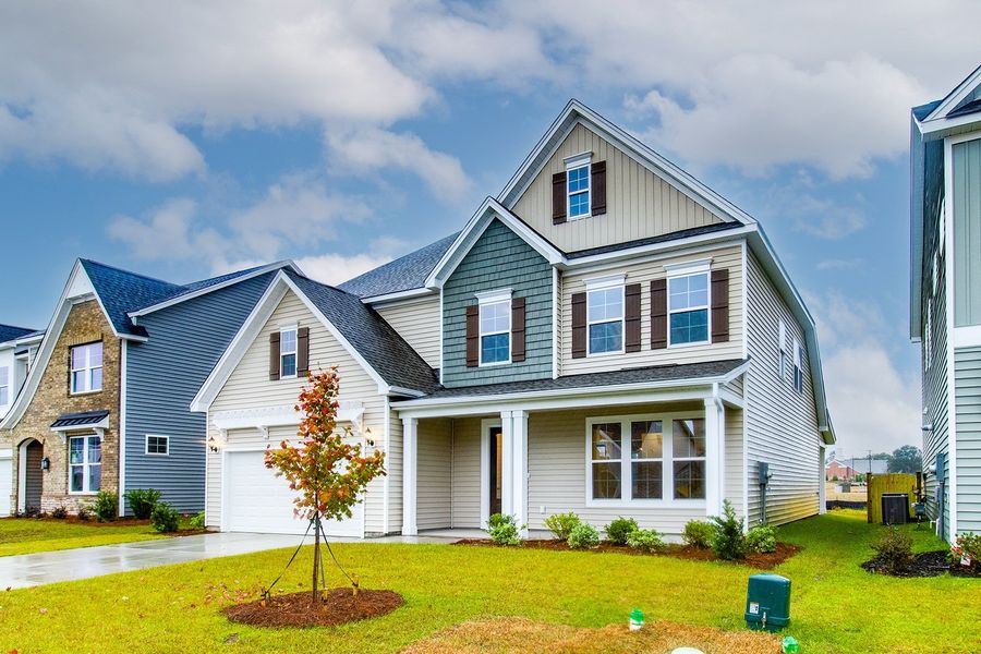 Front exterior of a new home in Hendrix Farms, Lexington, SC, highlighting curb appeal (Image 20). Front exterior of a new home in Hendrix Farms, Lexington, SC, highlighting curb appeal (Image 20).