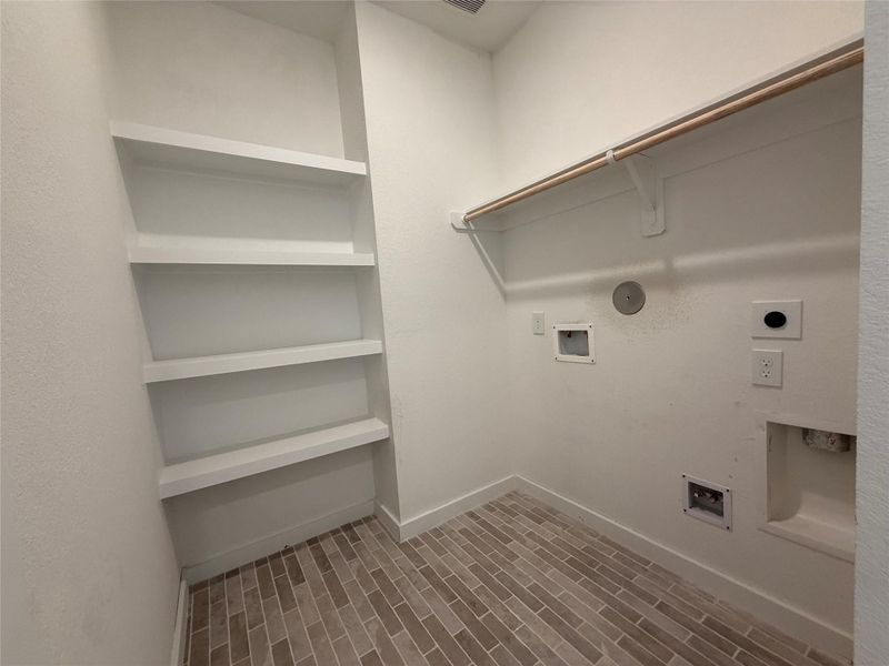 Large laundry room with built-in storage. Large laundry room with built-in storage.