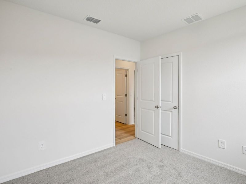 Spacious, unfurnished interior of a new home in The Grove at Stuart Crossing - Premier Series, Bartow (Image 14).