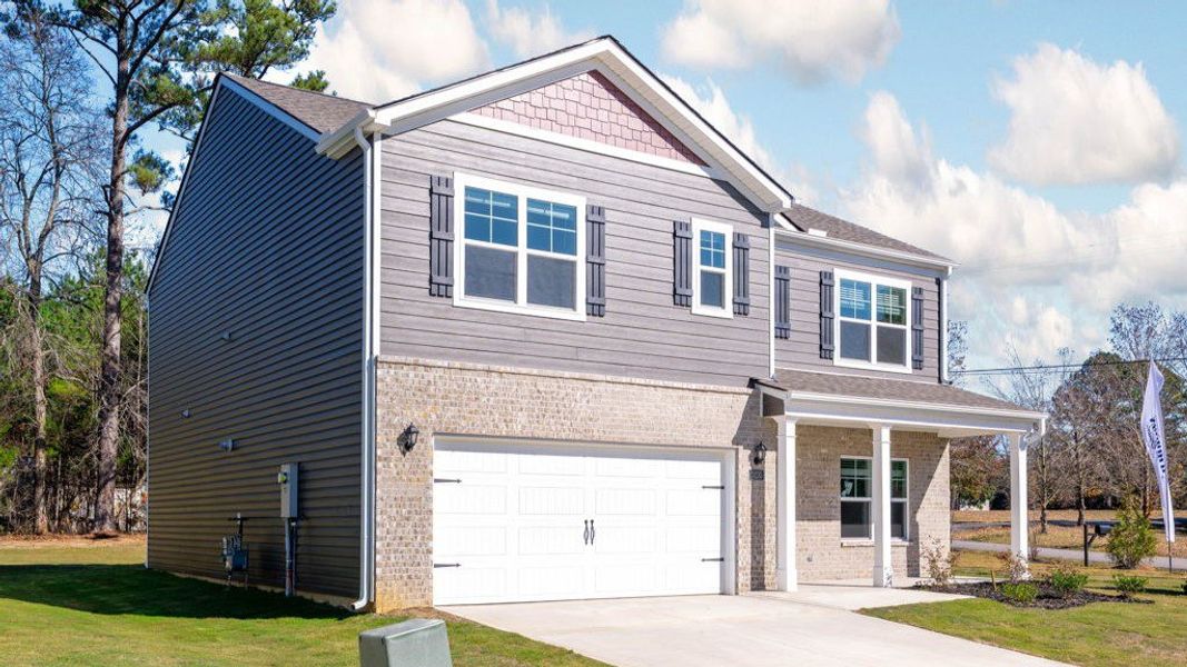 Front exterior of a new home in Hillcrest Landing, McDonald, TN, highlighting curb appeal (Image 17).