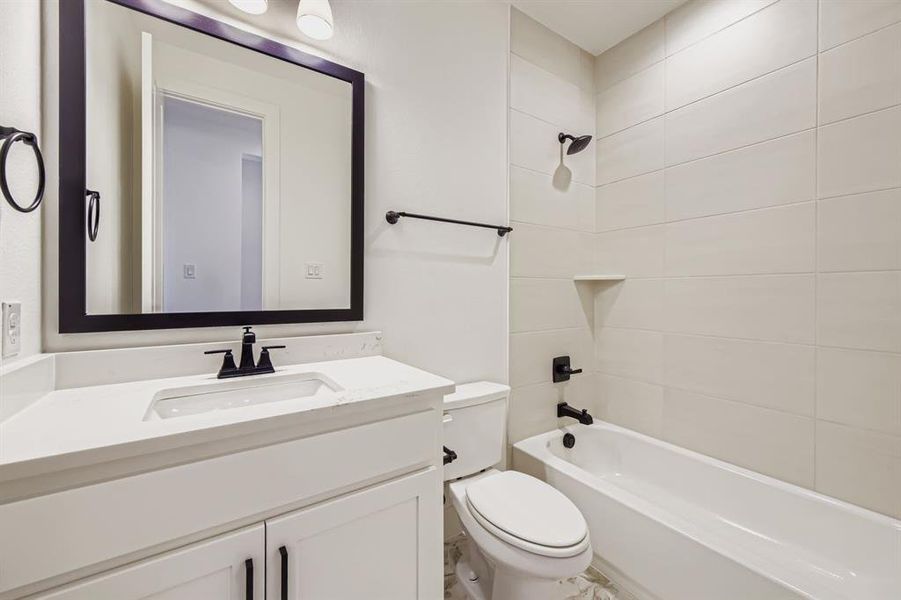 Full bath with shower / bathtub combination and vanity Full bath with shower / bathtub combination and vanity