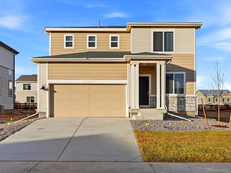 Front exterior of a new home in Revere at Johnstown, Johnstown, CO, highlighting curb appeal (Image 2). Front exterior of a new home in Revere at Johnstown, Johnstown, CO, highlighting curb appeal (Image 2).