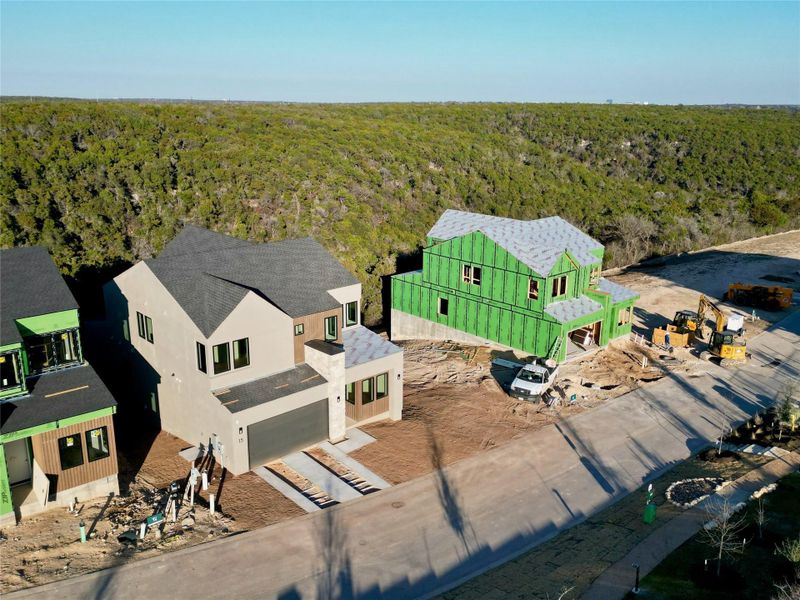 View of subject property with a heavily wooded area