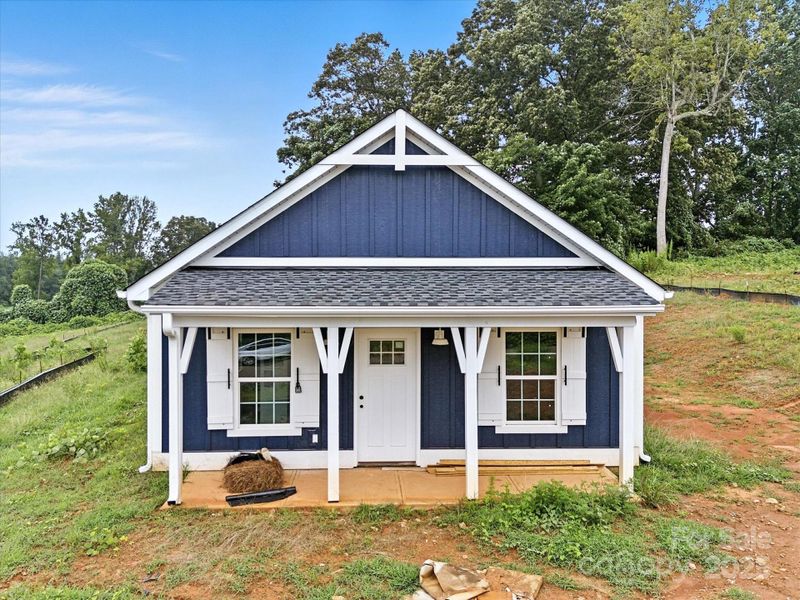 Front exterior of a new home in , Clover, SC, highlighting curb appeal (Image 19).