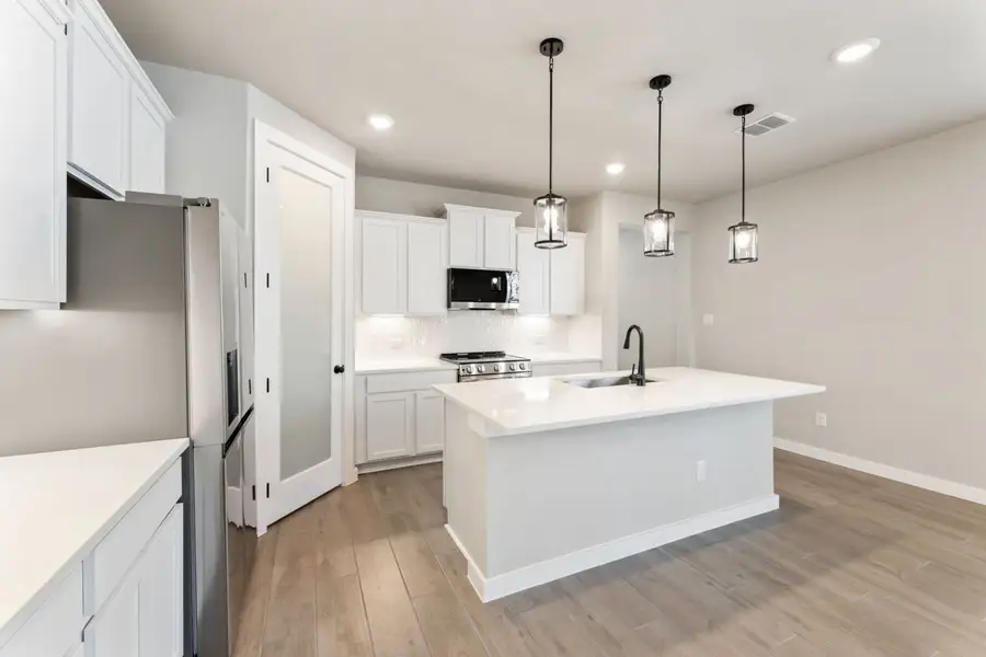 Representative furnished interior of a home built from the Pecos by Hakes Brothers in Highland Ridge, New Braunfels (Image 12).