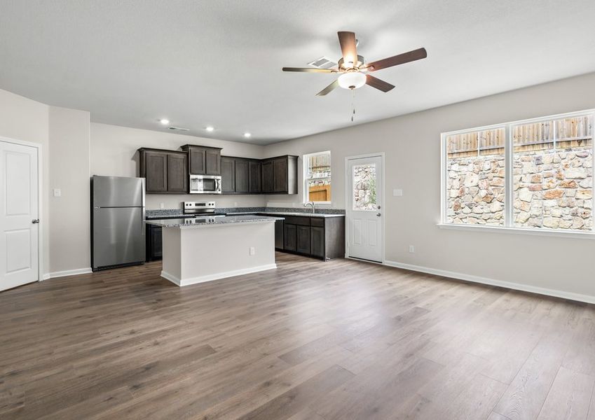 The kitchen, dining area and living room are all connected.
