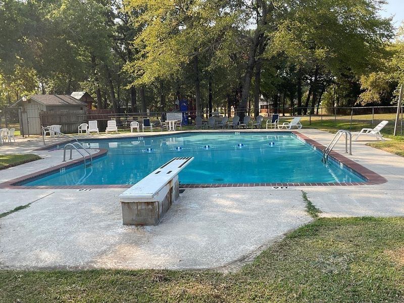 Community pool featuring a patio area