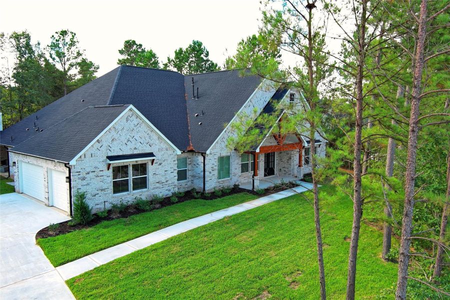 Front exterior of a new home in , Montgomery, TX, highlighting curb appeal (Image 24).