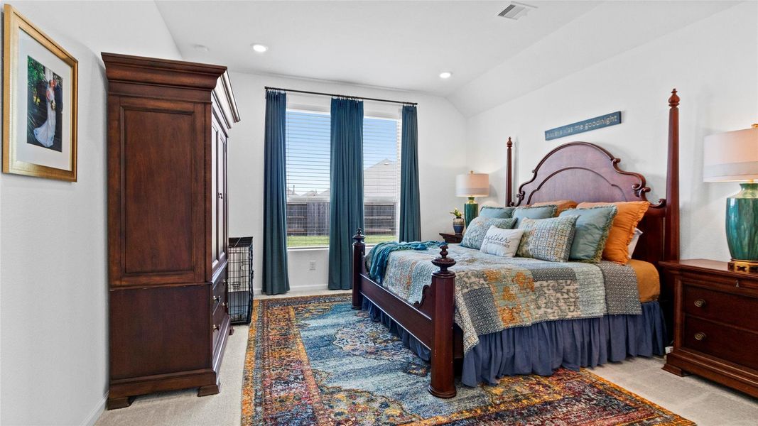 The spacious primary bedroom features high ceilings and large windows showcasing views of the outdoor space, creating a bright, open, and inviting retreat. The spacious primary bedroom features high ceilings and large windows showcasing views of the outdoor space, creating a bright, open, and inviting retreat.