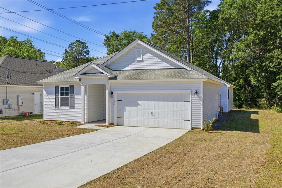 Front exterior of a new home in , Orangeburg, SC, highlighting curb appeal (Image 29).