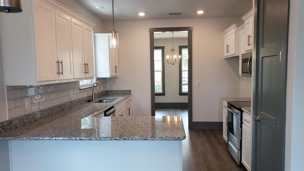 Representative furnished interior of a home built from the Plan 1808 by Adams Homes in Downtown Pensacola, Pensacola (Image 5).