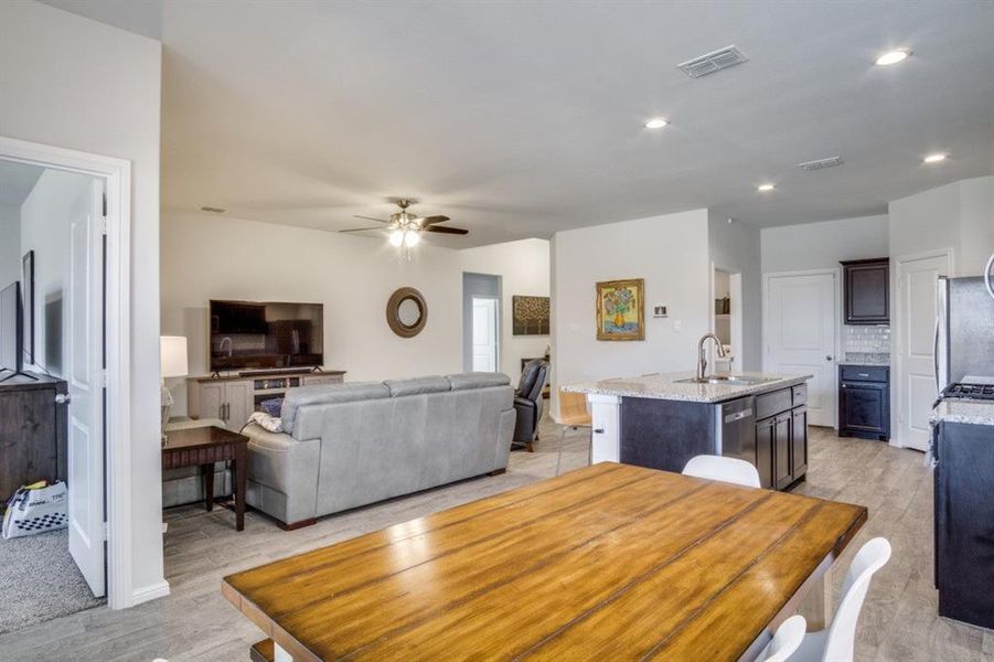 Dining space with visible vents, recessed lighting, light wood-type flooring, and a ceiling fan