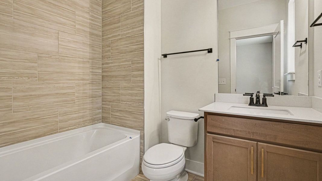 Bathroom with bathtub and dual vanities Bathroom with bathtub and dual vanities