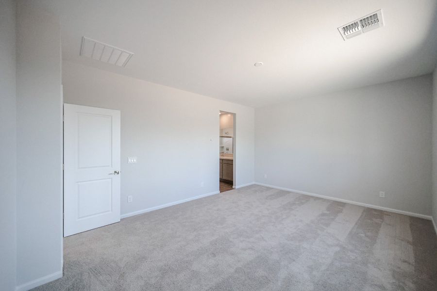 A hallway with white doors.