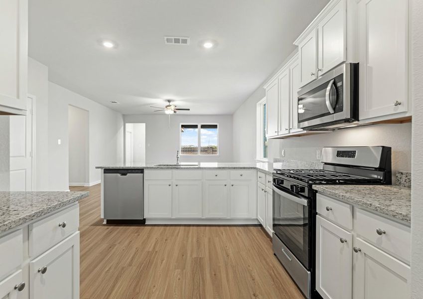 Chef-ready kitchen with granite countertops and stainless steel appliances