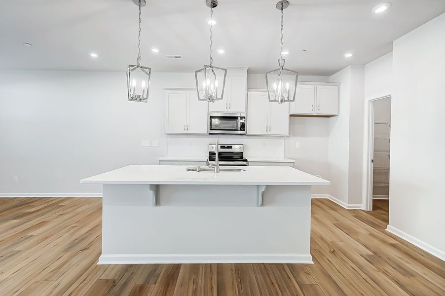 Kitchen with island breakfast bar