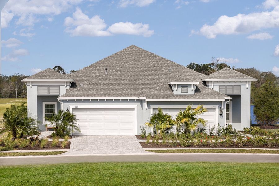 Representative exterior photo of a completed home built from the Crystal Sand 2 by Neal Communities in Wildleaf, Parrish, FL (Image 2). Representative exterior photo of a completed home built from the Crystal Sand 2 by Neal Communities in Wildleaf, Parrish, FL (Image 2).
