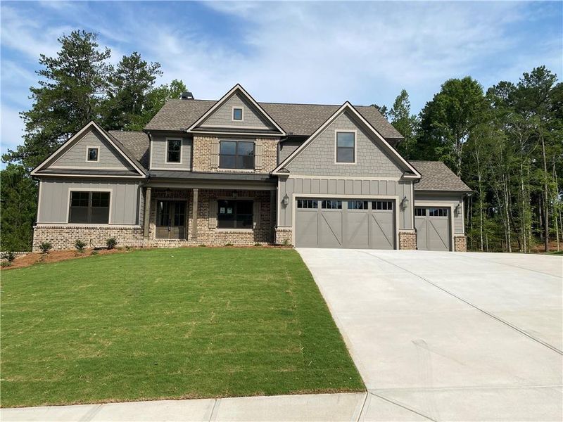 Front exterior of a new home in Spring Creek, Monroe, GA, highlighting curb appeal (Image 1). Front exterior of a new home in Spring Creek, Monroe, GA, highlighting curb appeal (Image 1).