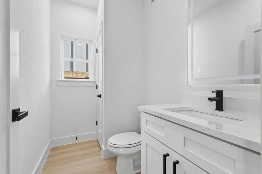 Bathroom with vanity and light wood finished floors Bathroom with vanity and light wood finished floors