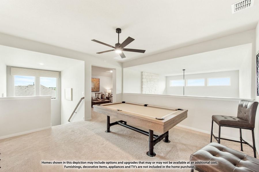 Game room with pool table, ceiling fan, and carpet flooring near staircase landing
