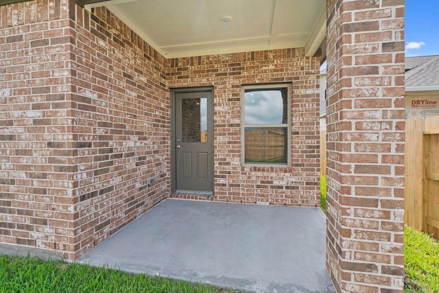 Exterior details and patio area of a home in Windrose Green, Angleton (Image 3).