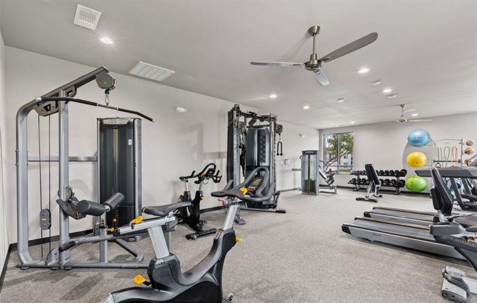 Gym with recessed lighting and ceiling fan