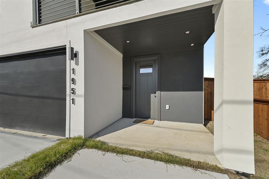 Entrance to property featuring a garage