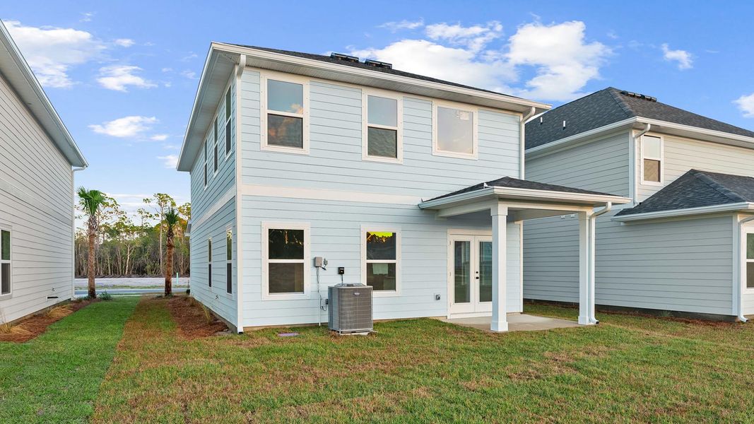 Exterior details and patio area of a home in Colonial East, Panama City Beach (Image 3).