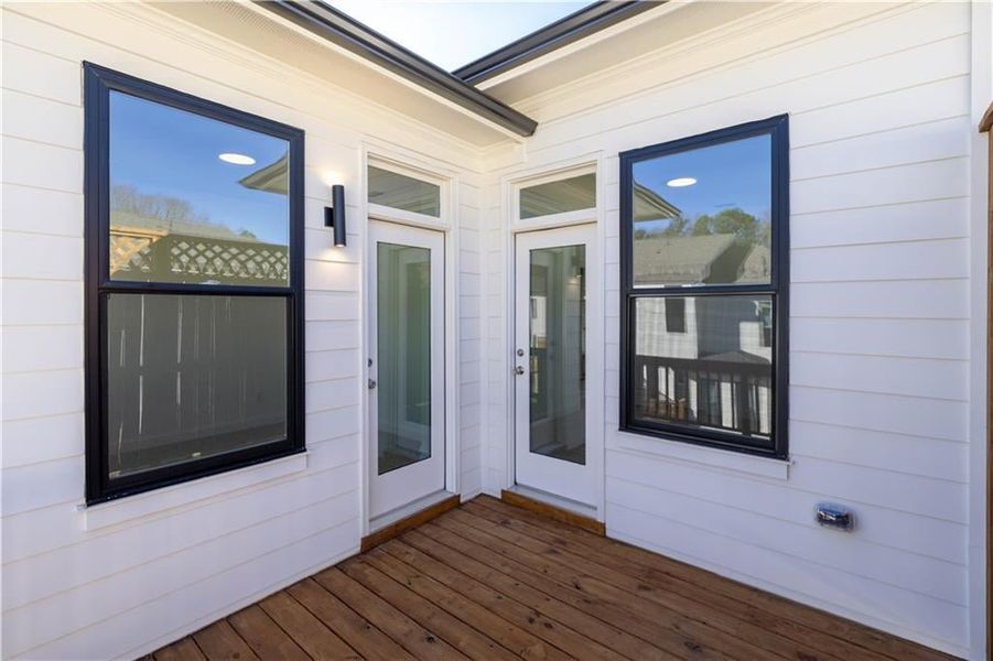 Both secondary bedrooms have doors to the upper outdoor deck.