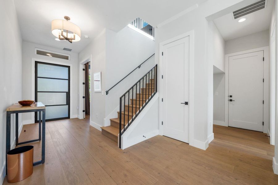 Entrance foyer featuring light wood-style flooring, recessed lighting, and stairway