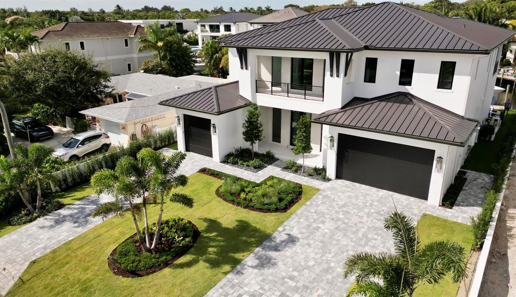 Front exterior of a new home in , Palm Beach Gardens, FL, highlighting curb appeal (Image 2).