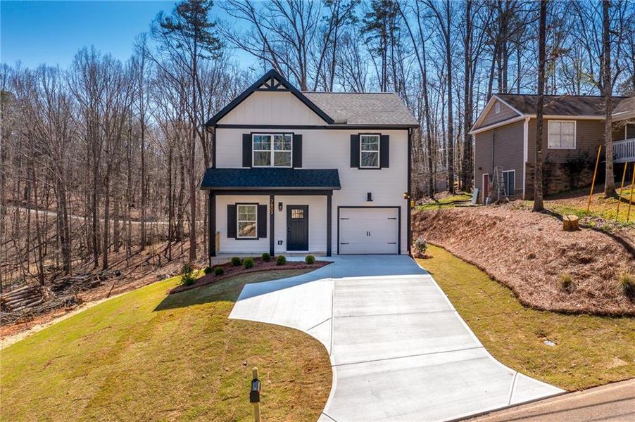 Front exterior of a new home in , Murrayville, GA, highlighting curb appeal (Image 1). Front exterior of a new home in , Murrayville, GA, highlighting curb appeal (Image 1).