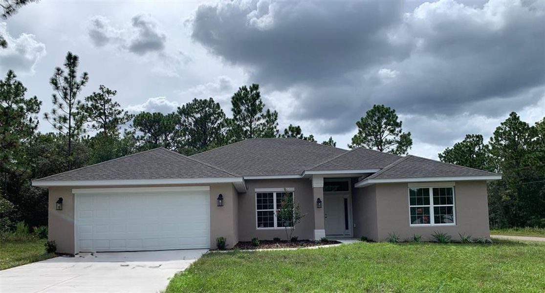 Front exterior of a new home in Citrus Springs Sub, Citrus Springs, FL, highlighting curb appeal (Image 7).
