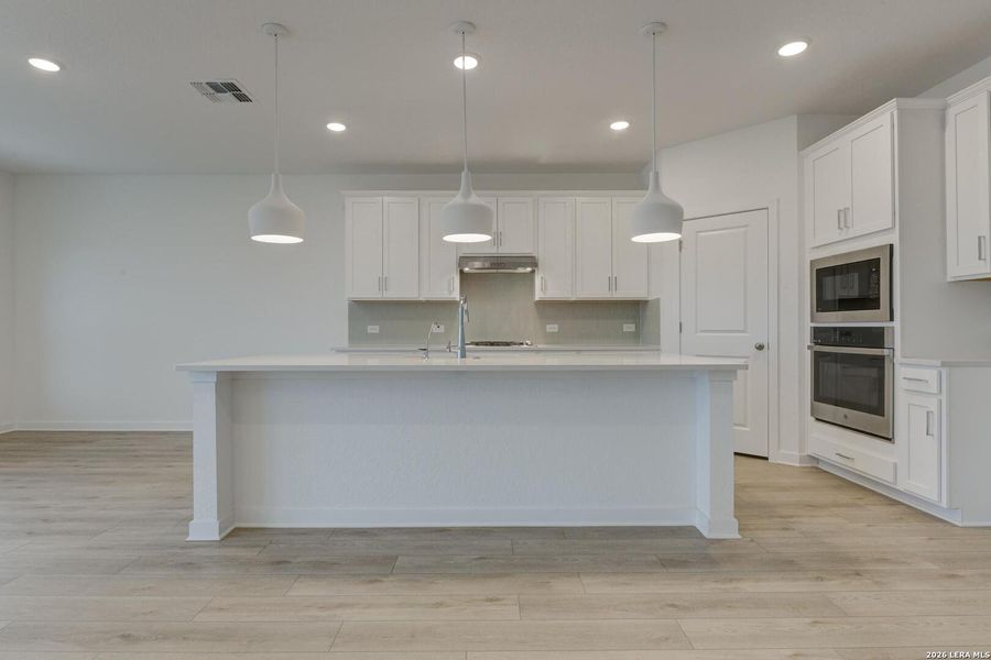 Furnished interior view inside a new home in Nopal Valley, San Antonio (Image 7).