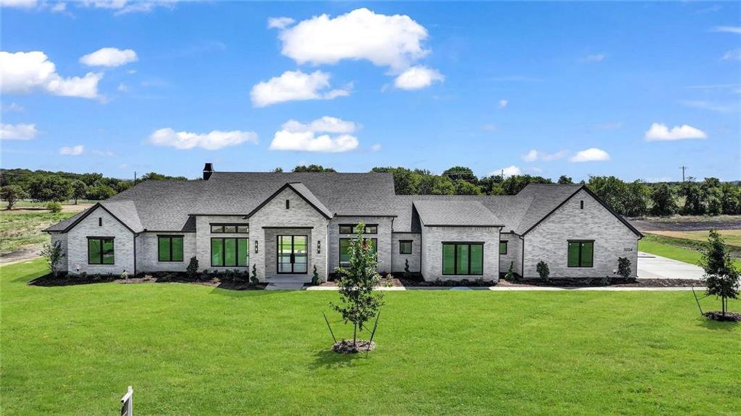 Front exterior of a new home in , Aledo, TX, highlighting curb appeal (Image 1).