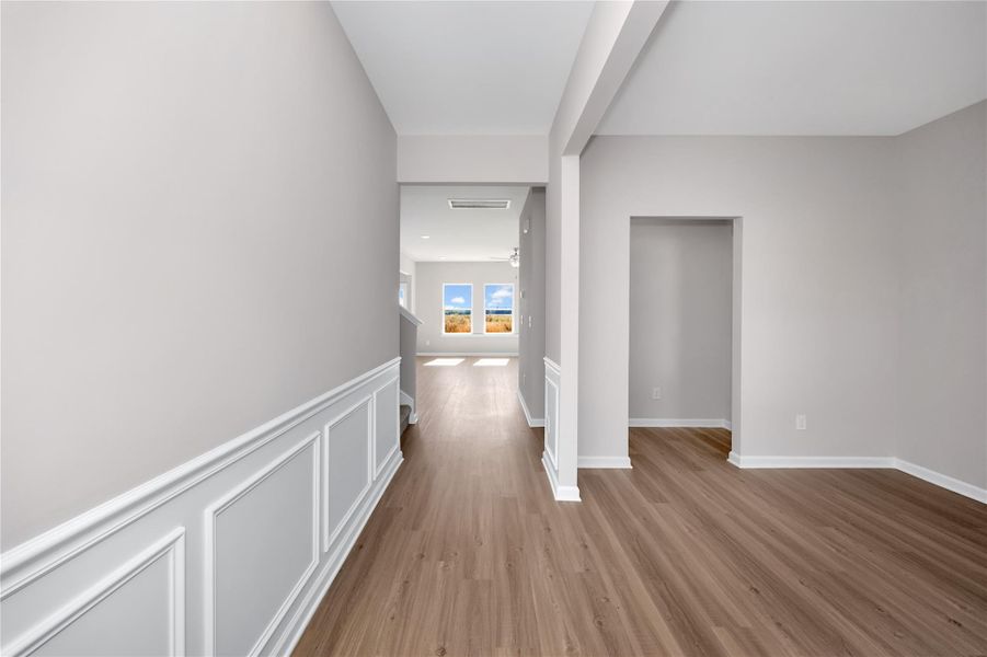 The Harrington- Foyer into Study (French doors not pictured). Sample image for illustration; upgrades, options, and colors may vary. The Harrington- Foyer into Study (French doors not pictured). Sample image for illustration; upgrades, options, and colors may vary.