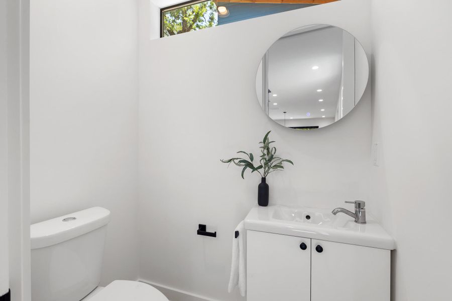 The conveniently located half bathroom provides easy access for residents and guests. The conveniently located half bathroom provides easy access for residents and guests.