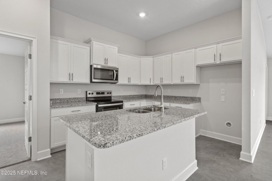 Furnished interior view inside a new home in Shadow Crest at Rolling Hills, Green Cove Springs (Image 5). Furnished interior view inside a new home in Shadow Crest at Rolling Hills, Green Cove Springs (Image 5).