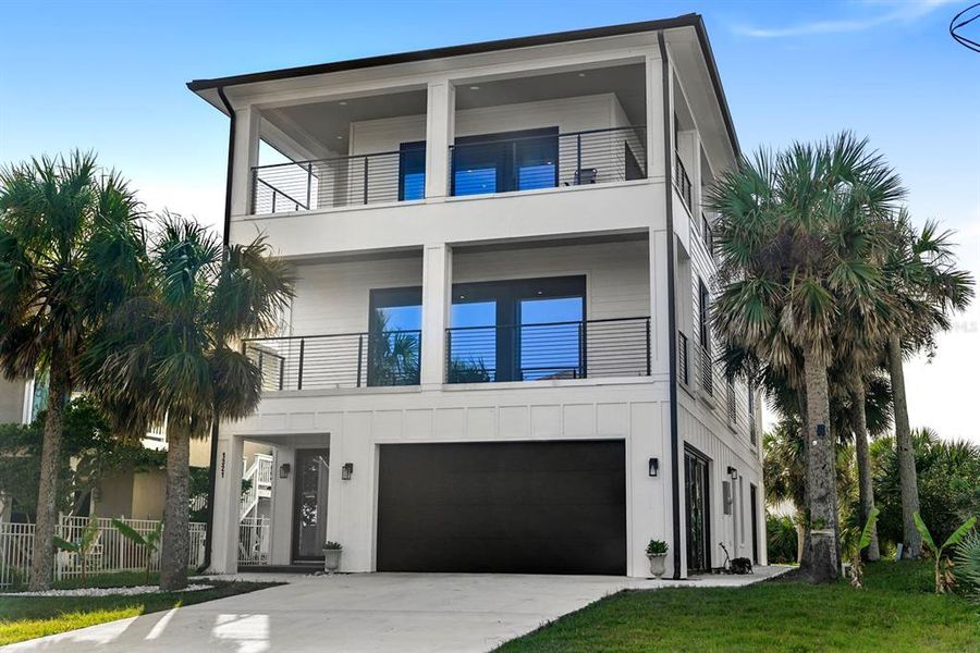 Front exterior of a new home in , Flagler Beach, FL, highlighting curb appeal (Image 21).